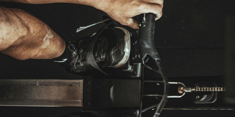 Detail of a mans hand on a gym equipment